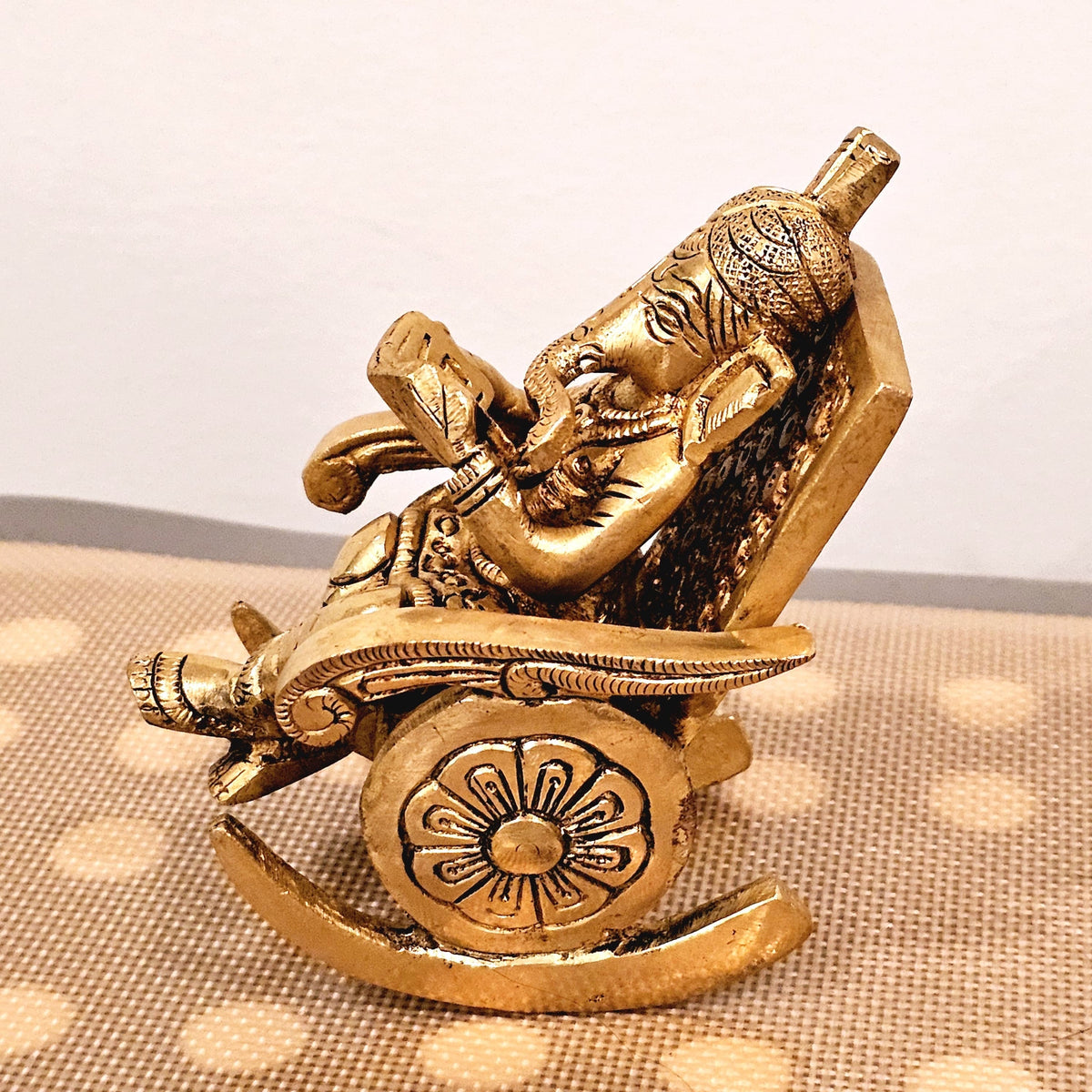 Swinging Ganapathi on a rocking chair.