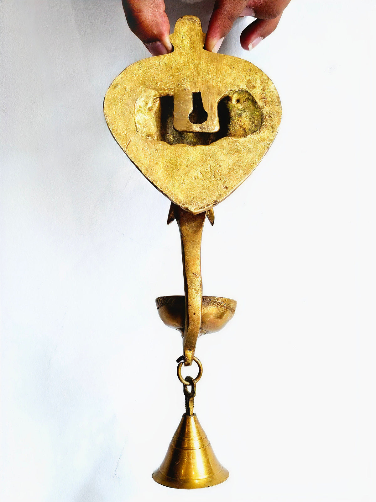 Brass Ganesha wall hanging with diya and bell, 11 inch