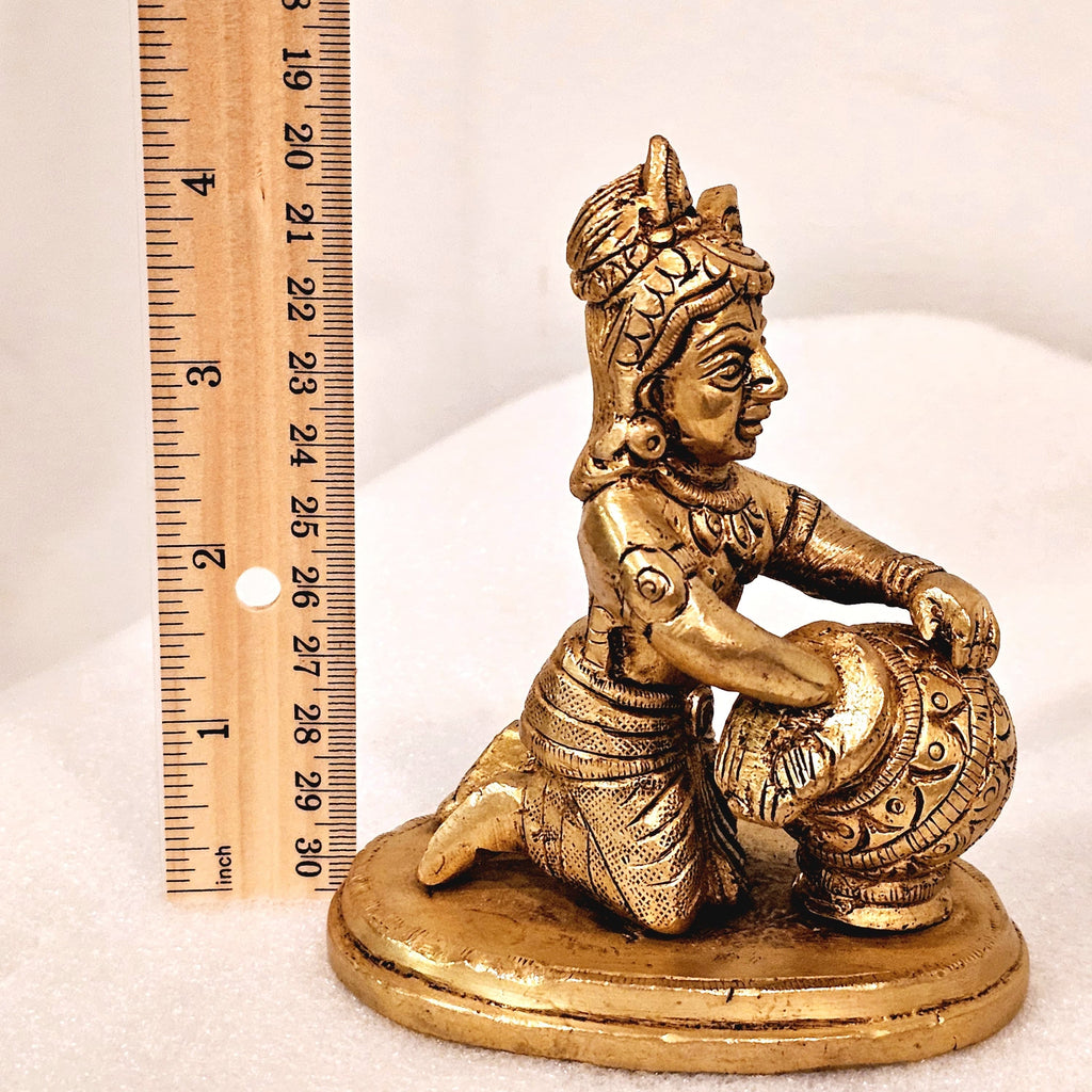 Bala Krishna eating butter. | brass