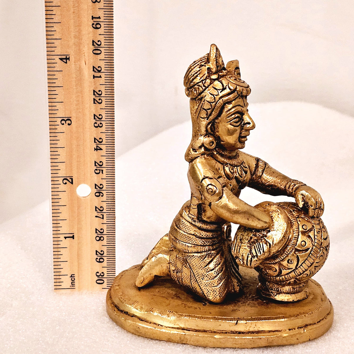 Bala Krishna eating butter. | brass