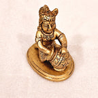 Bala Krishna eating butter. | brass