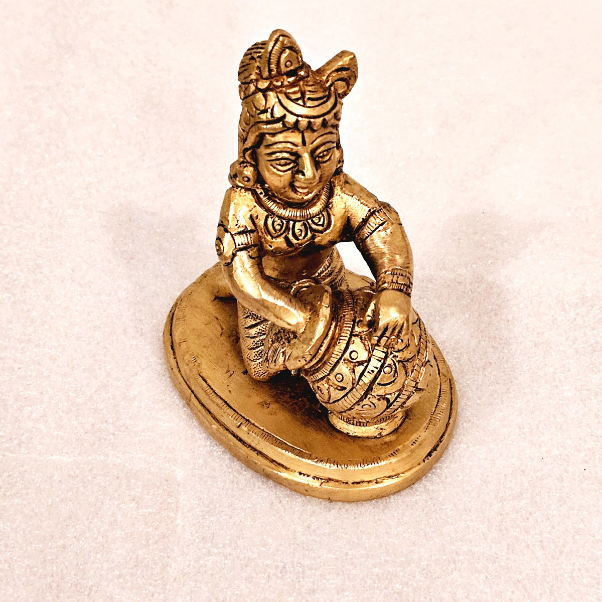 Bala Krishna eating butter. | brass