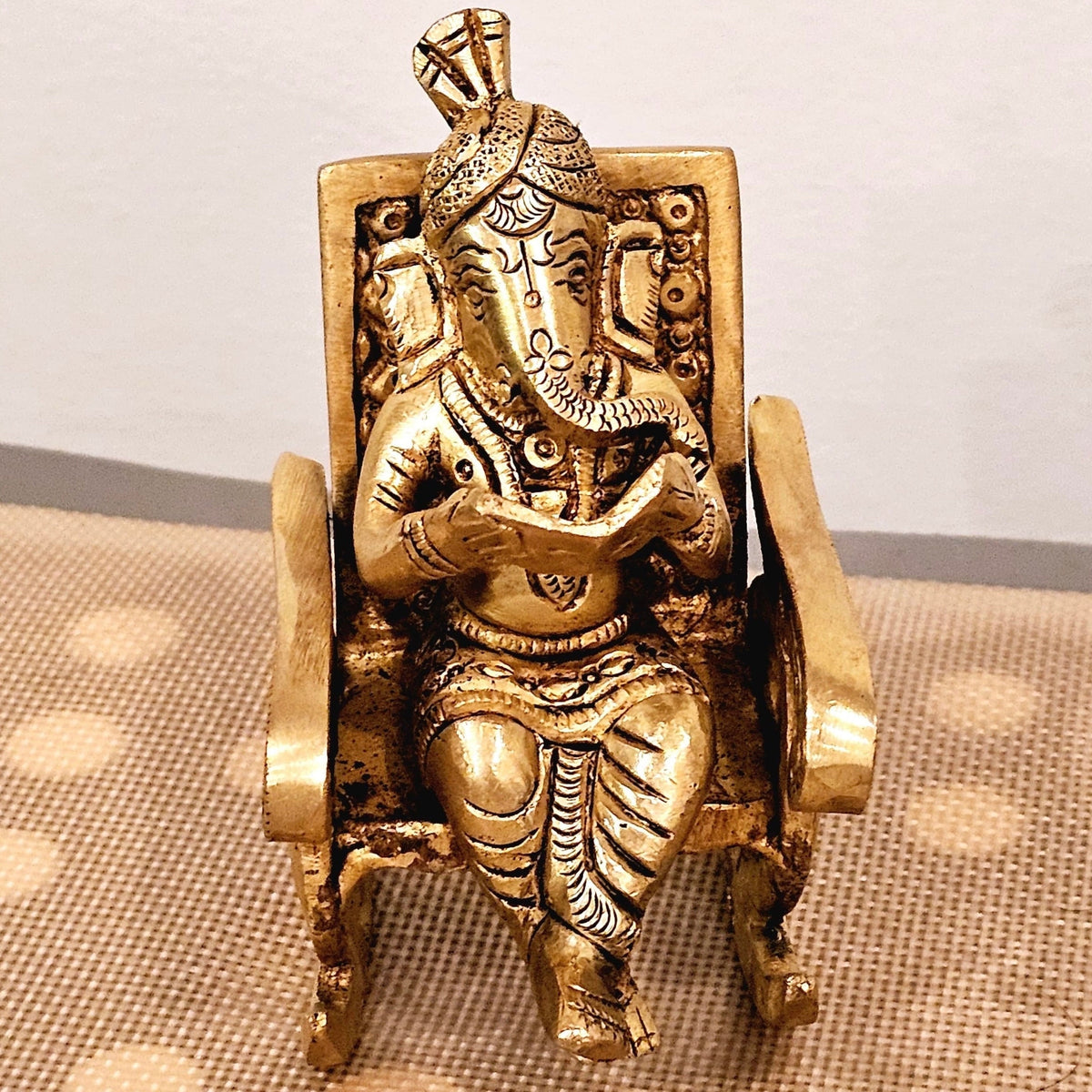 Swinging Ganapathi on a rocking chair.