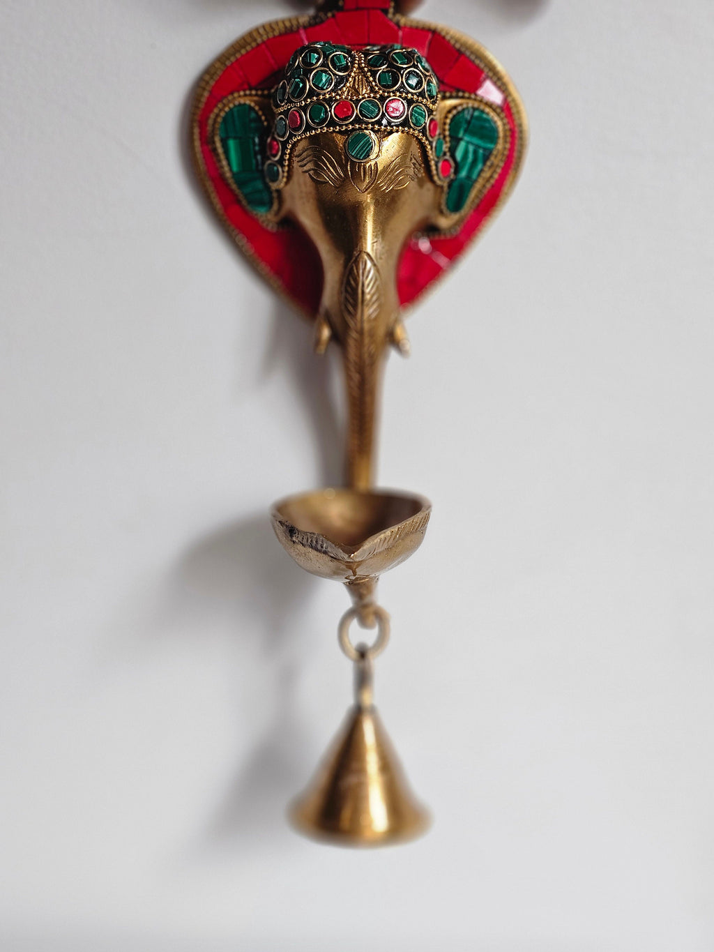 Brass Ganesha wall hanging with diya and bell, 11 inch