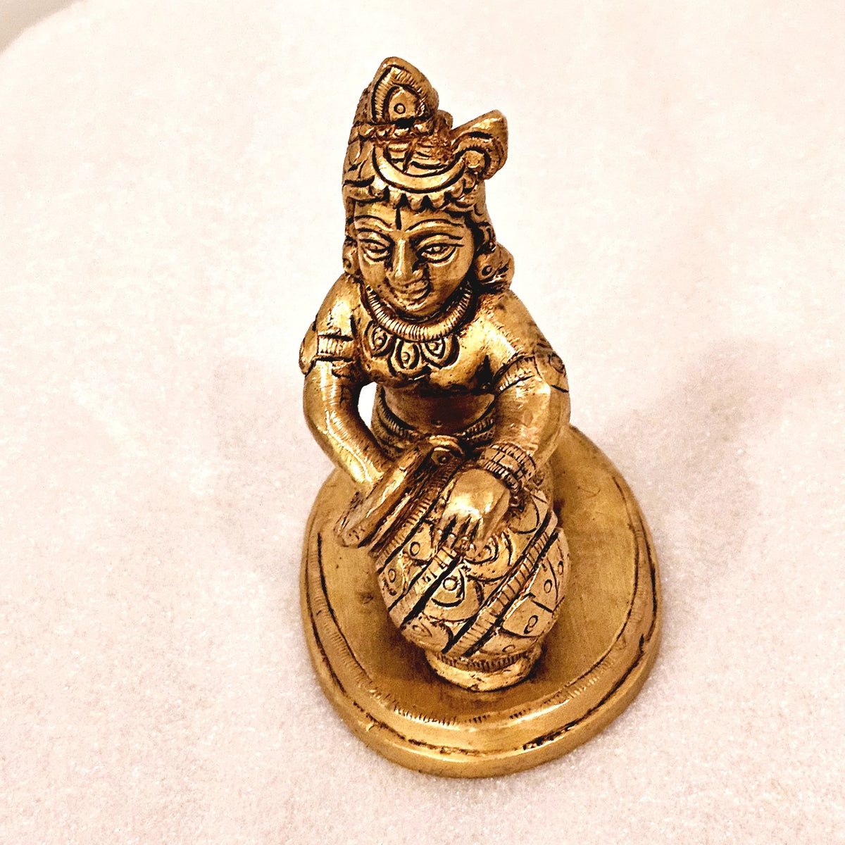 Bala Krishna eating butter. | brass