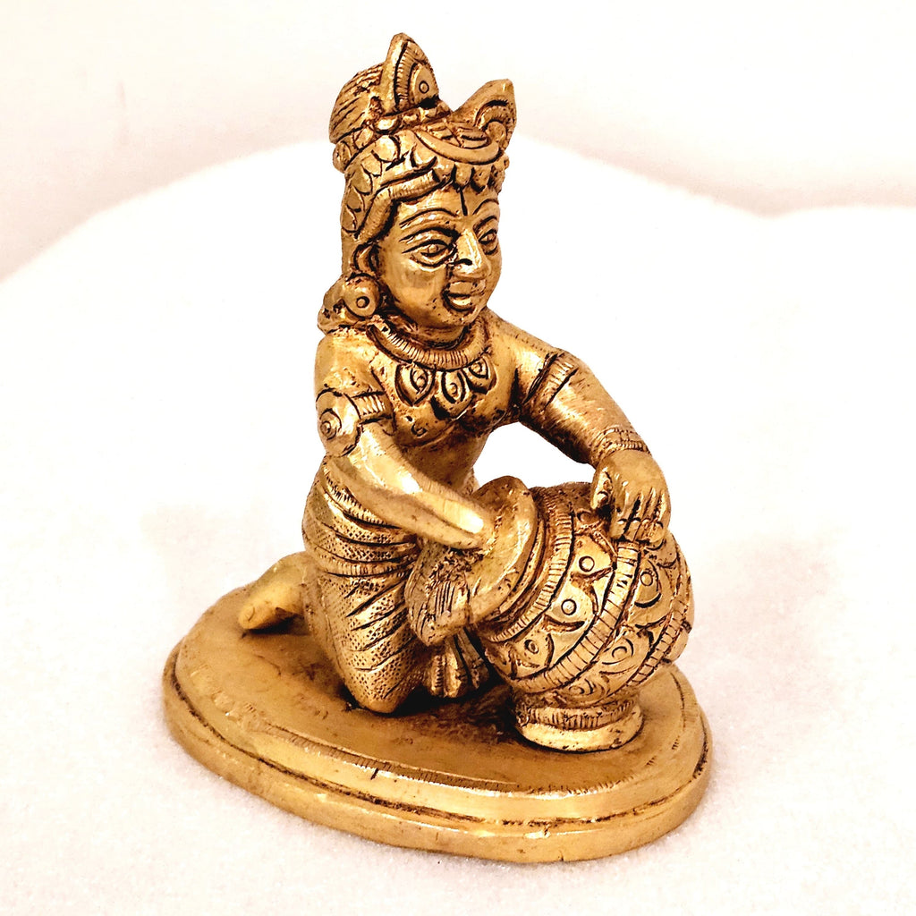 Bala Krishna eating butter. | brass