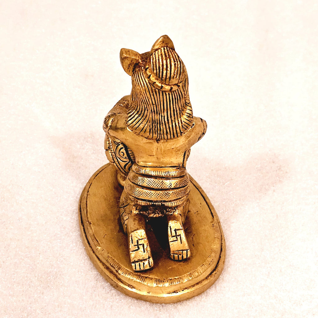 Bala Krishna eating butter. | brass